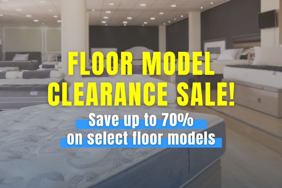 Display room full of new mattresses- Floor Model Clearance Sale, Save up to 70% on select floor models.